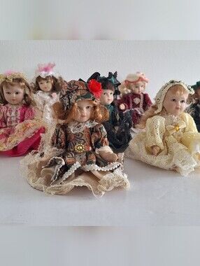 8 Small Porcelain Dolls